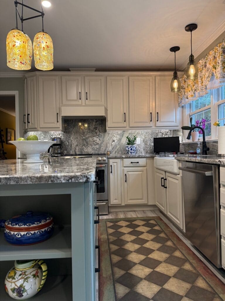 A new kitchen with white cabinetry.