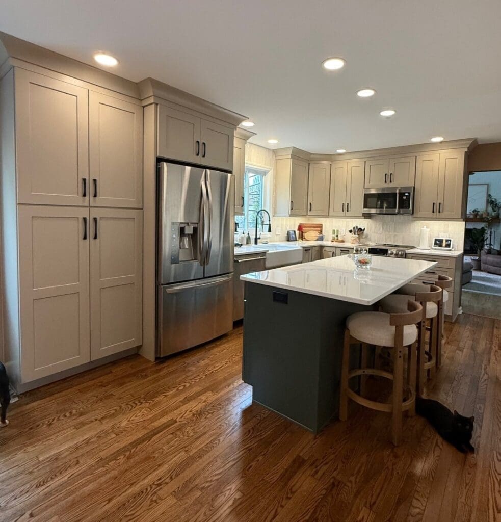 A kitchen with new, white cabinets.